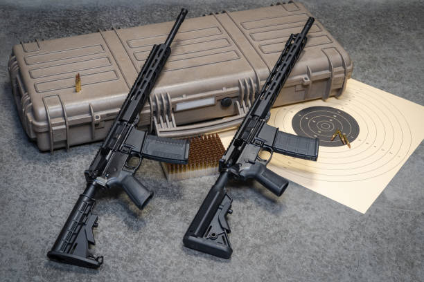Two AR15 assault rifles and hard case for weapon Two AR15 assault rifles and hard case for weapon, close-up photo carbine stock pictures, royalty-free photos & images