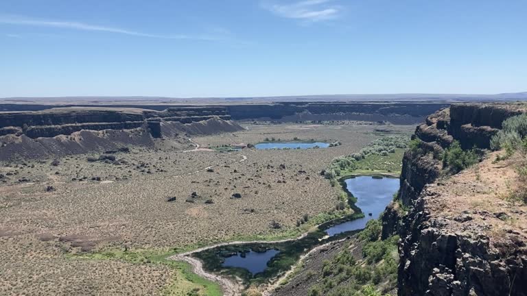 Panning shot of the huge canyon at Dry Falls State Park in Eastern Washington - USA