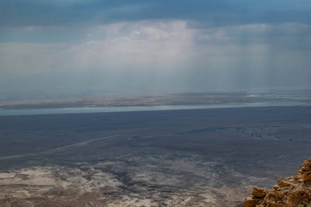 Dead Sea Opening A storm above the Dead Sea as seen from the fortress Masada in the Negev Dessert of Israel dead sea scrolls stock pictures, royalty-free photos & images