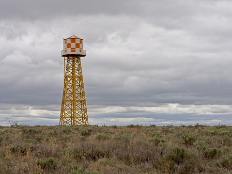 Colorful water tower against moody skies at the Amache National Historic Site, Colorado