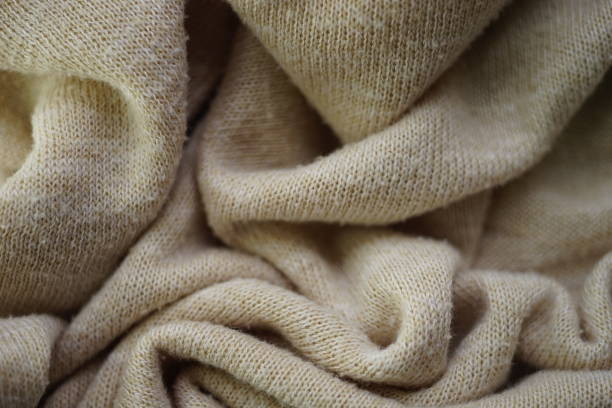 istock Knitted creamy background, beige sweater cozy pattern 1525830575