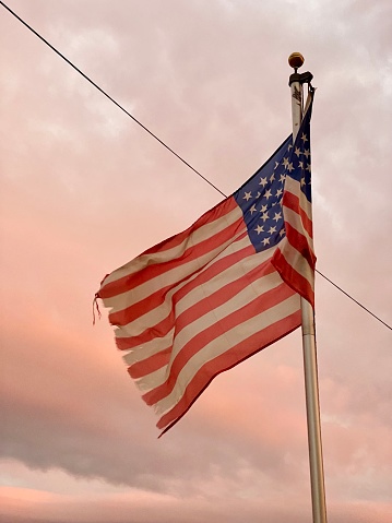 Weathered American Flag at Sunset