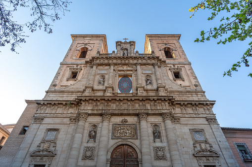 Lisbon, Portugal - January 4, 2023: Saint Peter Convent in Bairro Alto. Low-angle frontal view of an old church with beautiful stone sculptures and engravings.