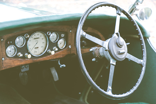 The cockpit of a vintage car