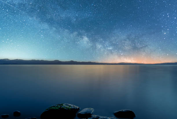 istock Beautiful night landscape,  bright Milky Way galaxy  on the lake. 1526025113