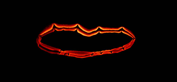 istock burning paper, glowing edge of paper on a black background 1526036457
