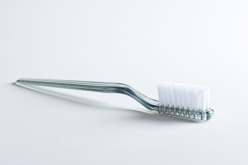 Gray toothbrush on white background.