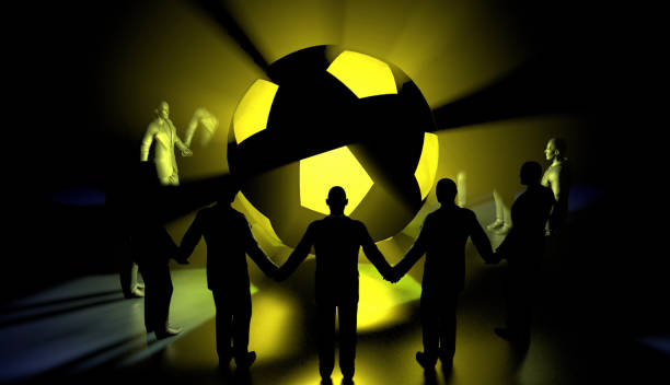 Holding hands around a revolving soccer ball, people intend together for the future. A symbolic peace story. People connecting with rising social media.