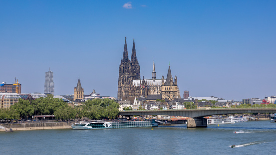 Cologne, Germany - Jun 6th 2023: Cologne cathedral is iconic and internationally known landmark in German city. It's twin towers are visible all over the city.