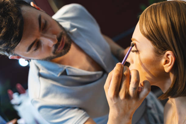 istock Makeup Artist Working Applying The Eyeshadow 1526309392