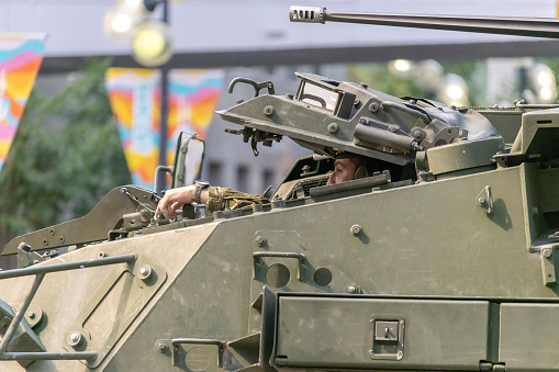 Calgary, Alberta, Canada. July 7, 2023. A close up to a Canadian Armed Force armoured main battle tank with a soldier in at a public festival parade.