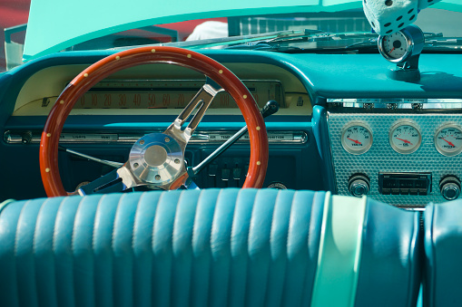 View of the vintage car dashboard from the rear seat