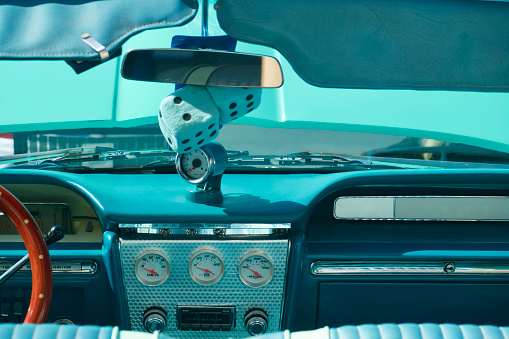 View of the vintage car dashboard from the rear seat