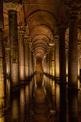 Istanbul, Turkey – November 21, 2022: The rows of columns reflected in water in the restored Basilica Cistern, Istanbul, Turkey