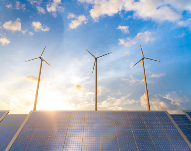 istock Alternative energy concept with wind turbines and solar panels 1526566086