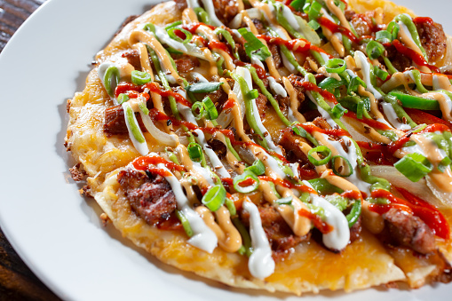 A view of a Korean Mexican pizza.