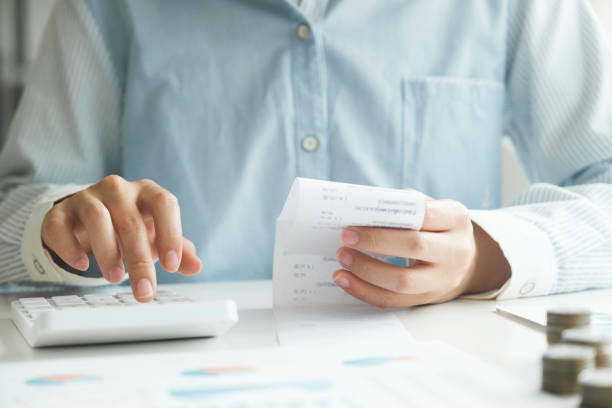 istock Accountant using calculator for calculate finance report in office. 1526694980