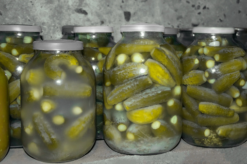 Jars of salted cucumbers. Canned foods. Canned and preserved foods