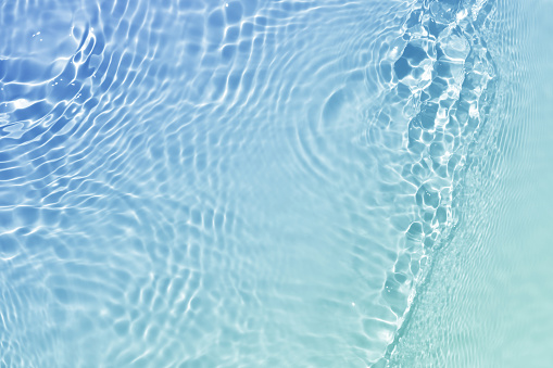 Light blue water rippled surface background