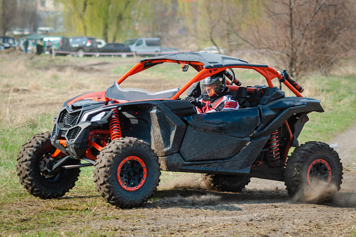 ATV and UTV offroad vehicle racing in a dust. Extreme, adrenalin. 4x4