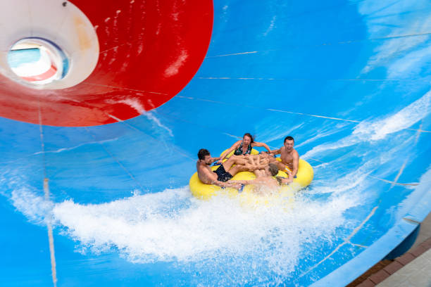 istock Frinds on big colorful water slide at aquapark 1526737569