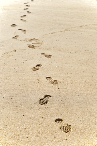 Shoe marks on the sandy beach