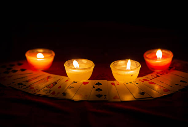 istock Candle lighting and divination with cards horoscope concept images 1526807709