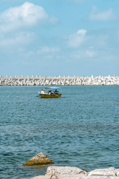 View of boat over blue water near coast of Valletta, Malta