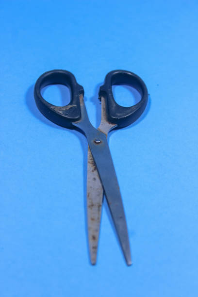 istock A black pair of scissors used for cutting was placed on the table 1526876729