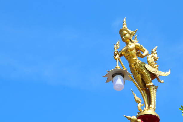 istock Golden statue top of pillar. 1526880334
