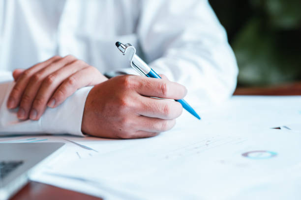 istock Hand businessman signing contract. 1526929692