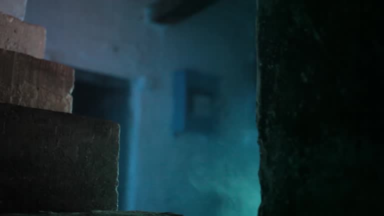 Shot of stairs of an abandoned fallen building with fog, HD footage 24 fps. Concept of Halloween.