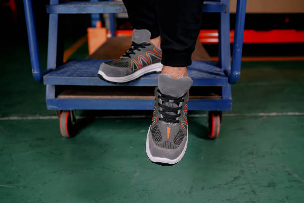 istock A worker is coming down the stairs 1527016299