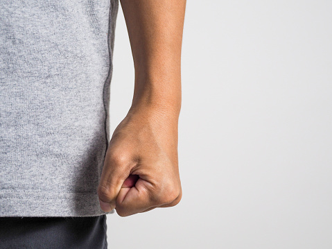 Man's hand fisted in anger. Violence. Domestic violence.