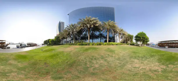 Palm trees and a green lawn complement the landscape design of a modern business center.
