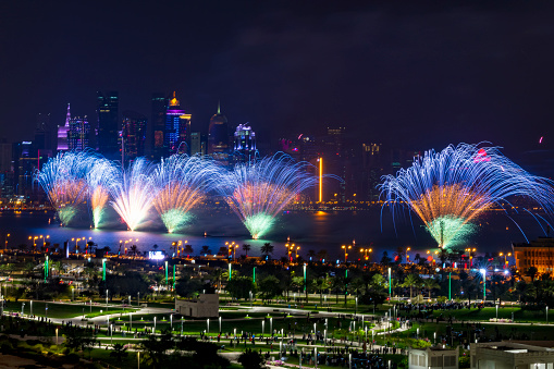 Doha, Qatar - December  18, 2022: Qatar national day fireworks with Qatar skyline