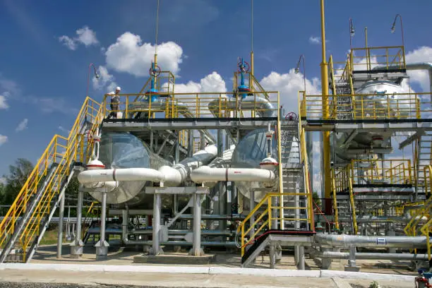 Technological equipment and pipelines as part of a crude oil purification plant.