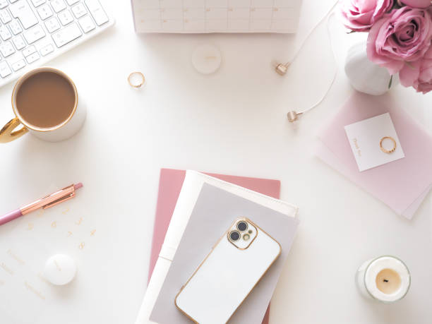 istock Flat lay top view of white pc desk, feminine workspace image 1527124400