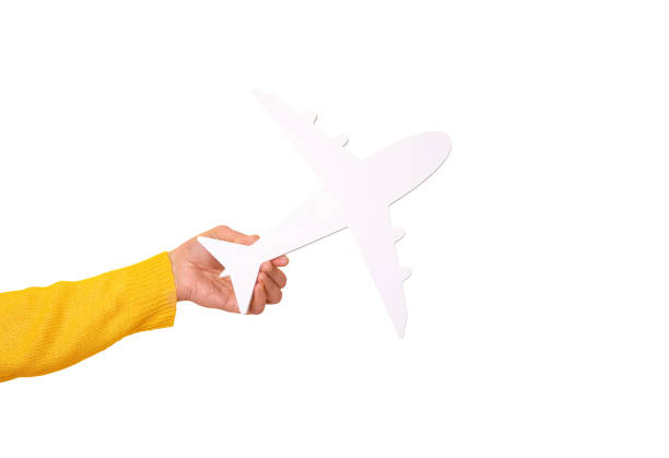 istock airplane symbol in hand isolated on white background 1527191024