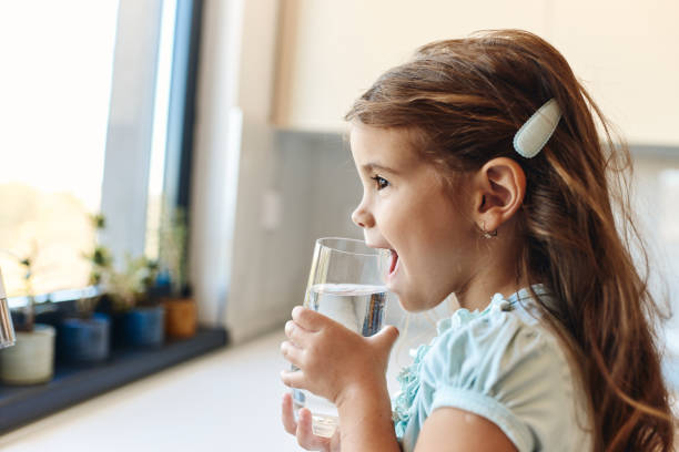 istock Beautiful girl drinking water 1527315137