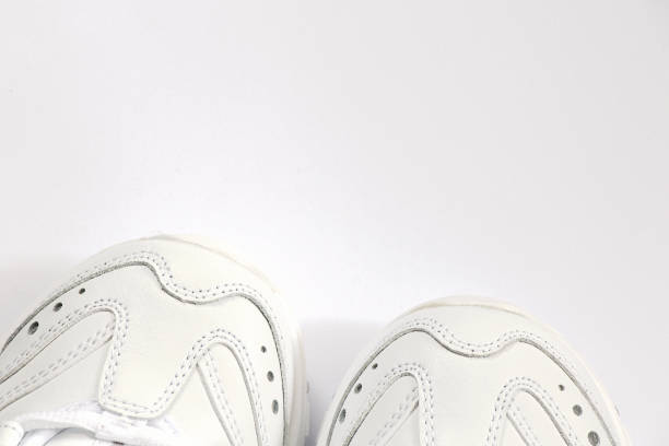 istock white women's new sneakers on a white background top view 1527341606