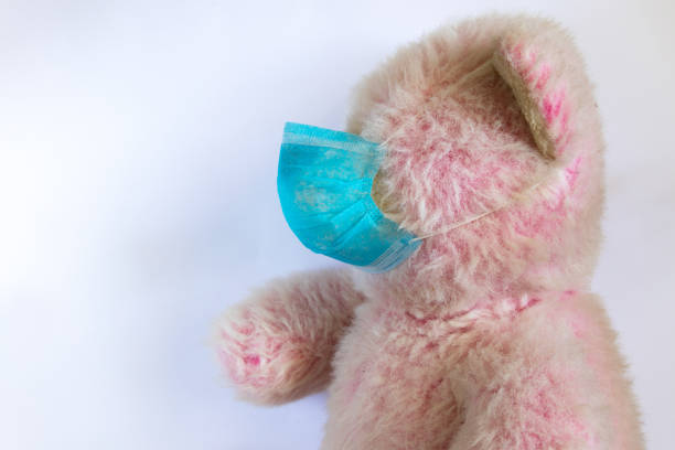 medical teddy bear masked closeup coronavirus epidemic stock photo