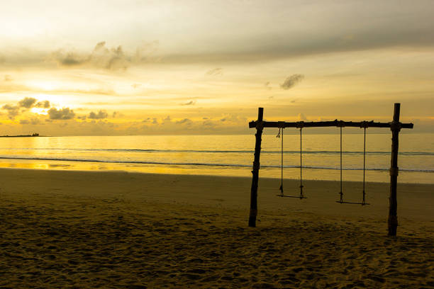 istock Sunset and wood Swing on Khao Lak beach in Phang-nga 1527352964