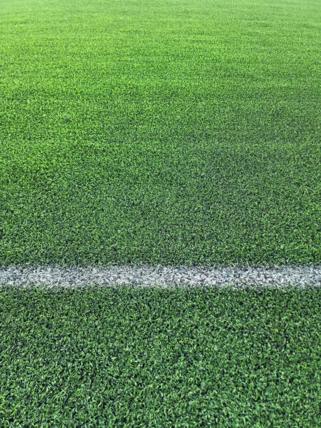 istock Artificial grass football field background 1527373069