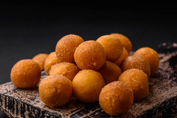 istock Delicious fried potato balls with breaded mozzarella, salt, spices and herbs 1527376329