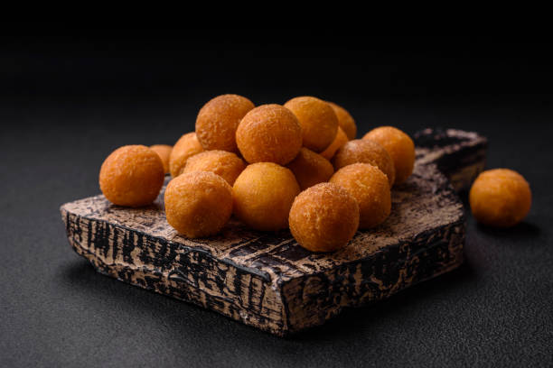 istock Delicious fried potato balls with breaded mozzarella, salt, spices and herbs 1527378982