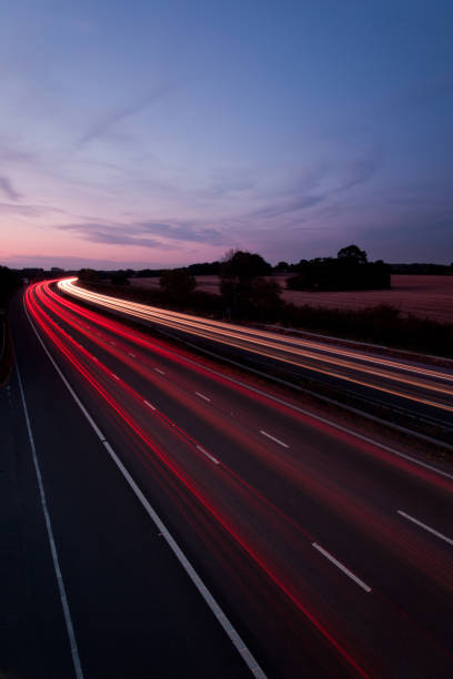 M25 motorway traffic light trails at dusk, London, England, United Kingdom, Europe stock photo
