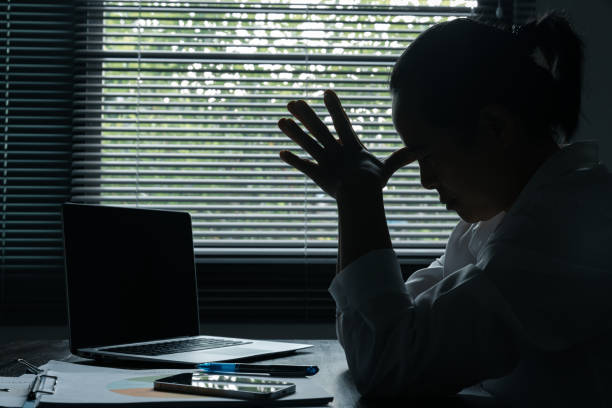 istock A woman battles depression and stress in her workplace, highlighting the challenges faced by professionals. This image captures the impact of mental health on employees in a corporate environment. 1527406128