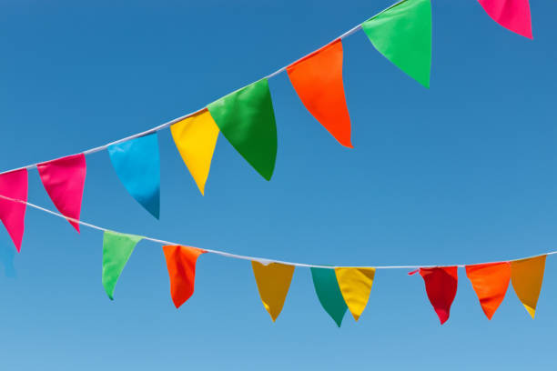 istock Colorful pennant string decoration against summer sky 1527415820