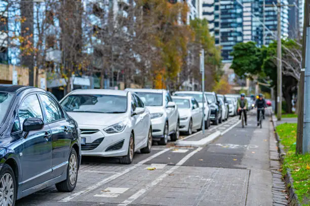 A fully packed roadside parking space next to a bicycle lane in Melbourne CBD